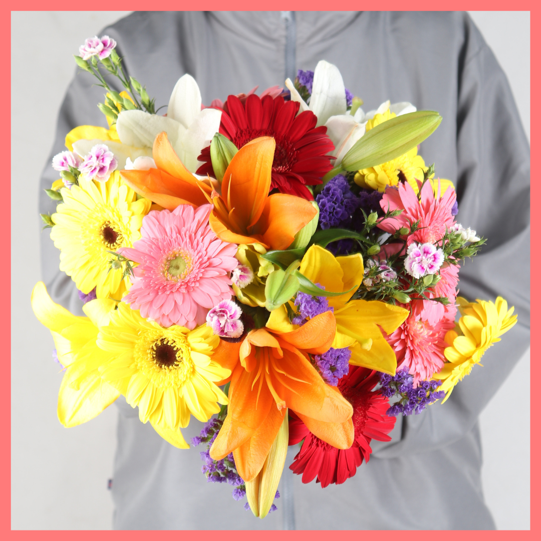 The Be My Baby bouquet includes mixed stems of lilies, gerbera daisies, pompons, photinia, and brillantina! Please note that as flowers are a live product, colors, and varieties may slightly vary from the photos shown to provide you with the freshest and most beautiful bouquet.