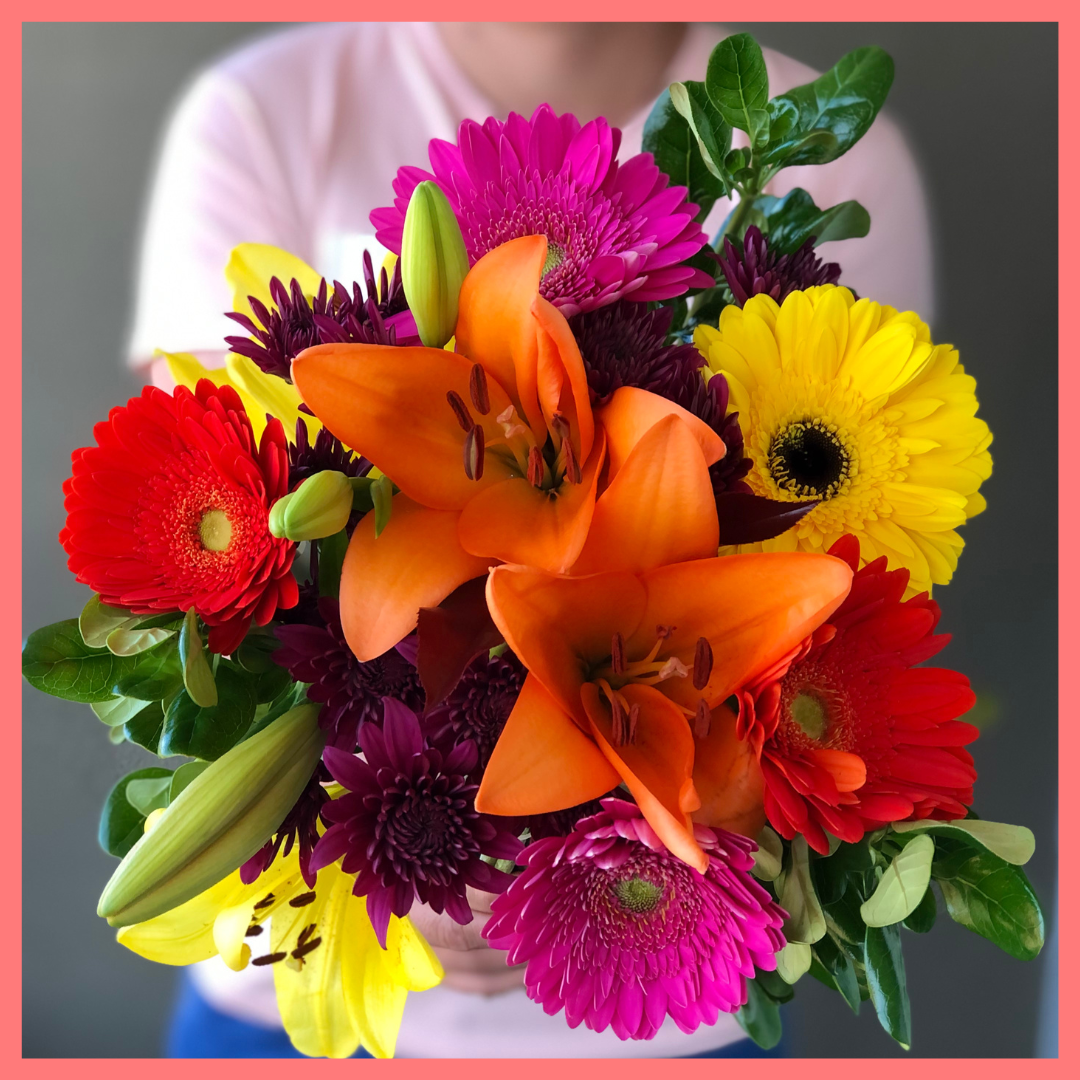  The Rainbow Snowcone bouquet includes mixed stems of lilies, gerbera daisies, CDN pompoms, photinia, and brillantina!