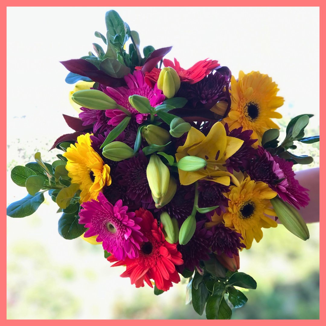  The Rainbow Snowcone bouquet includes mixed stems of lilies, gerbera daisies, CDN pompoms, photinia, and brillantina!