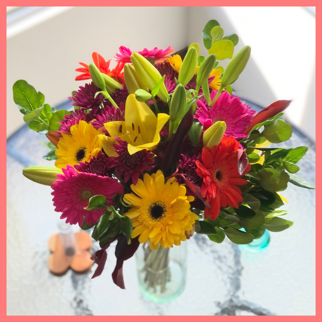  The Rainbow Snowcone bouquet includes mixed stems of lilies, gerbera daisies, CDN pompoms, photinia, and brillantina!