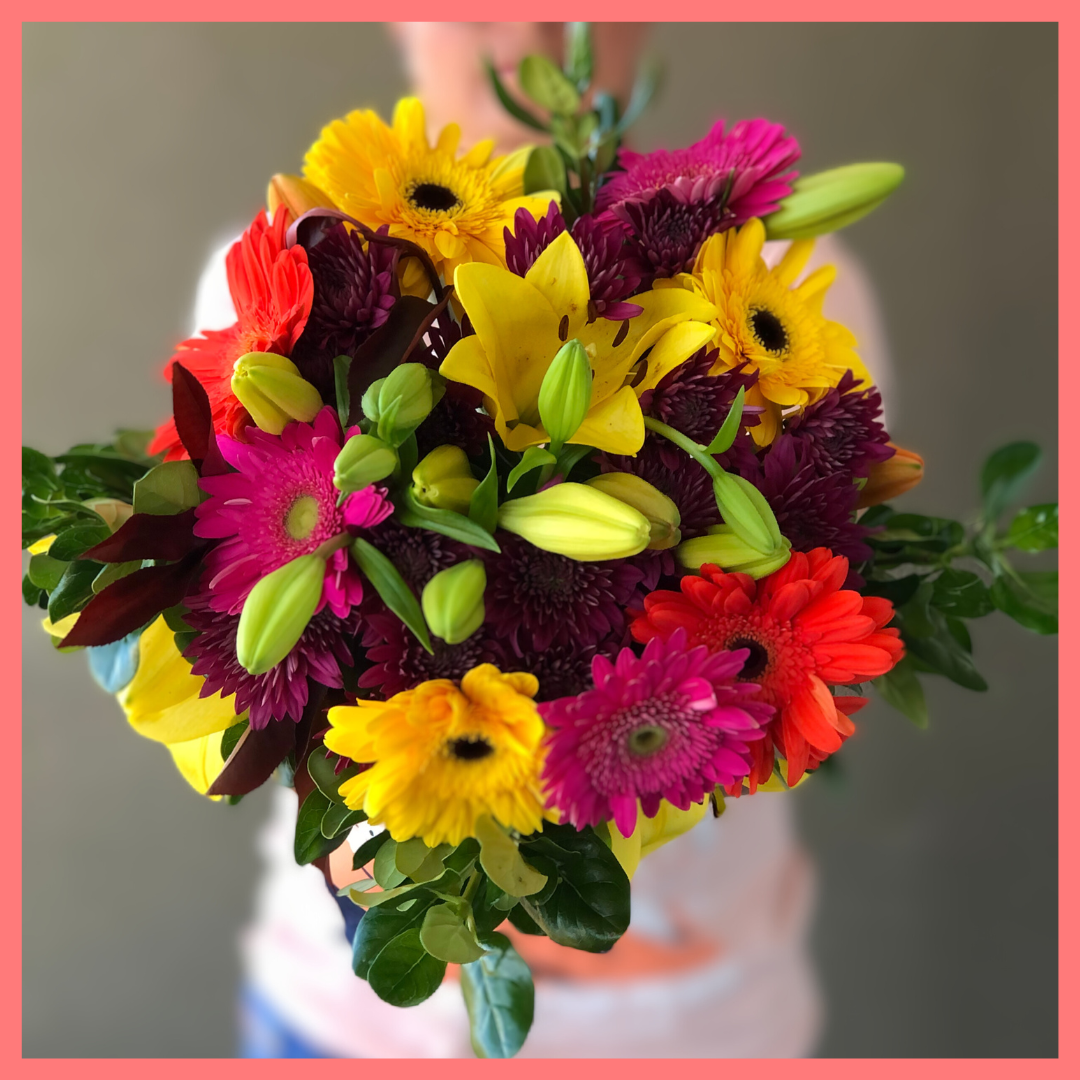  The Rainbow Snowcone bouquet includes mixed stems of lilies, gerbera daisies, CDN pompoms, photinia, and brillantina!