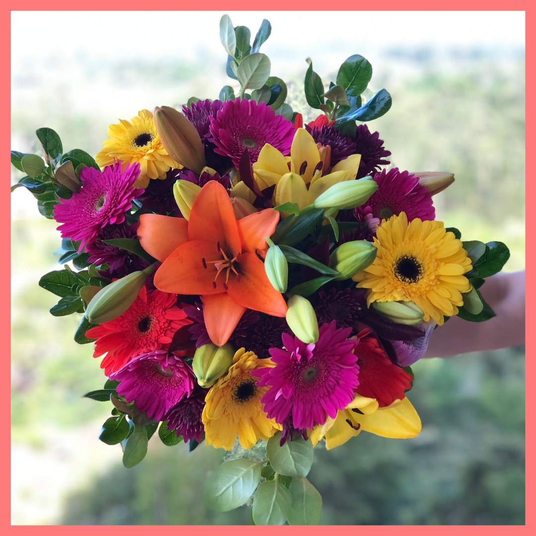  The Rainbow Snowcone bouquet includes mixed stems of lilies, gerbera daisies, CDN pompoms, photinia, and brillantina!