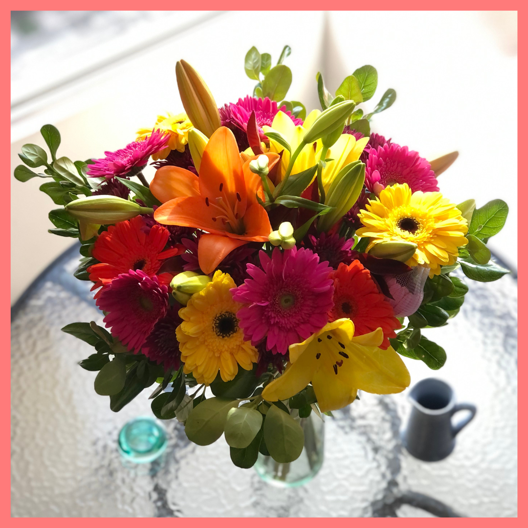  The Rainbow Snowcone bouquet includes mixed stems of lilies, gerbera daisies, CDN pompoms, photinia, and brillantina!