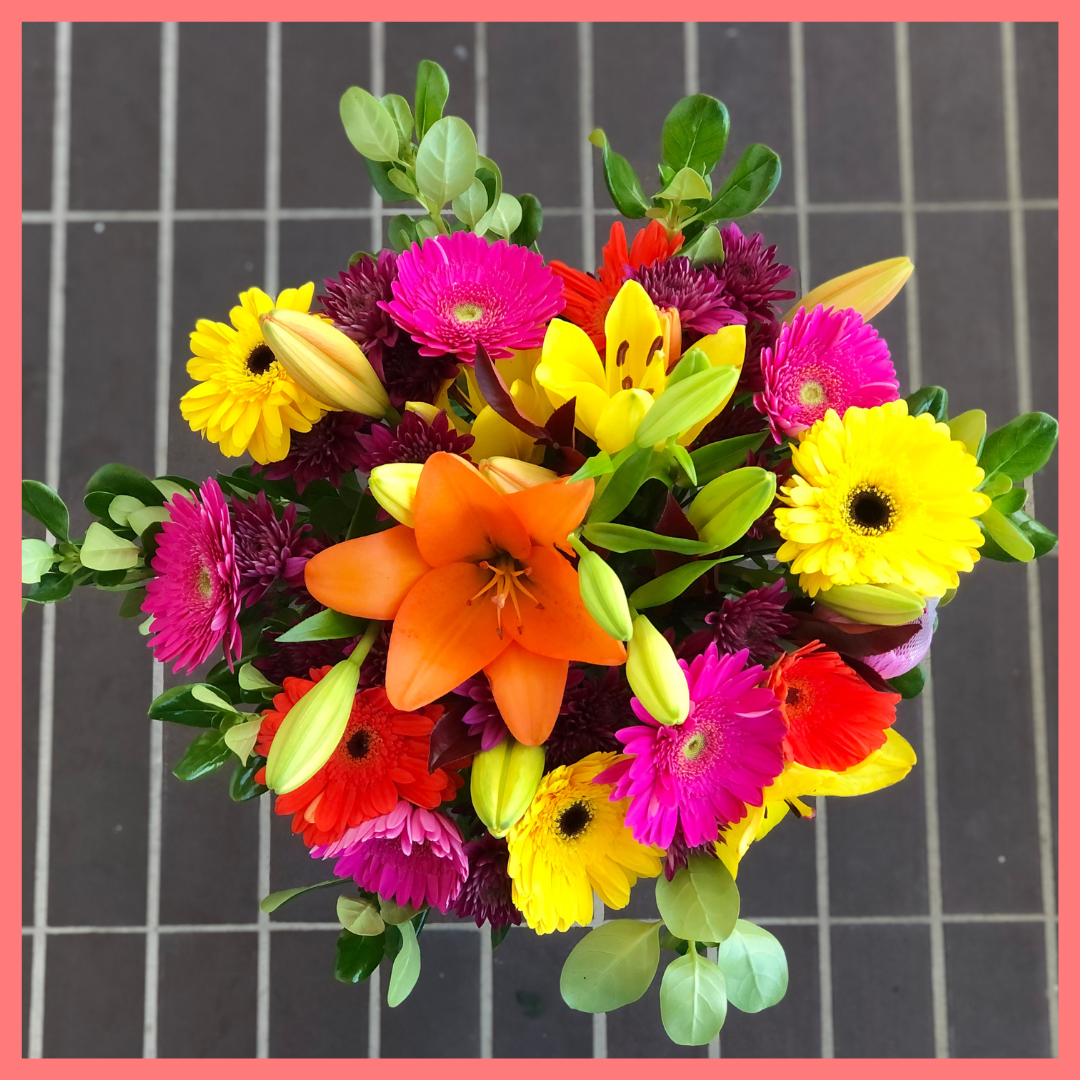  The Rainbow Snowcone bouquet includes mixed stems of lilies, gerbera daisies, CDN pompoms, photinia, and brillantina!