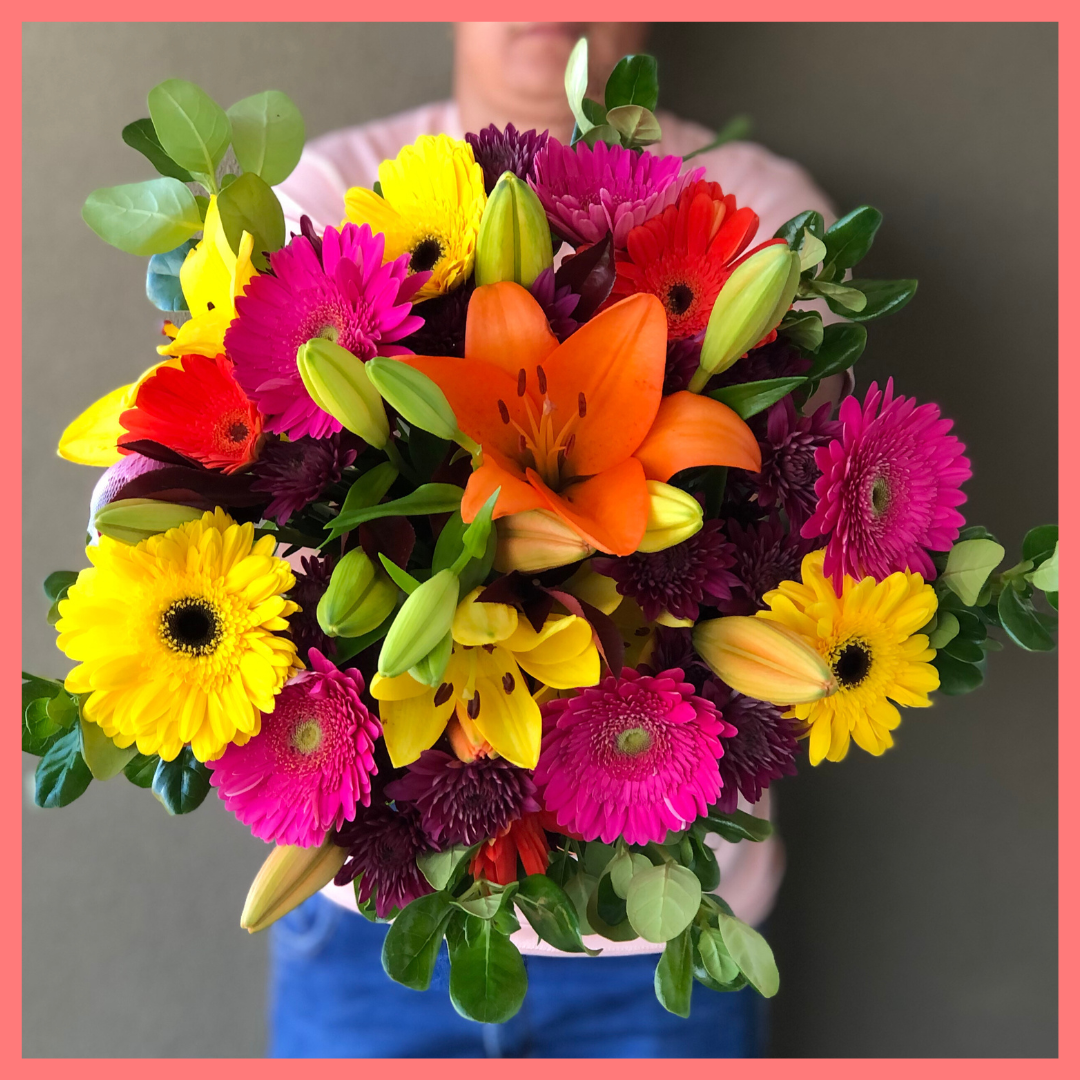  The Rainbow Snowcone bouquet includes mixed stems of lilies, gerbera daisies, CDN pompoms, photinia, and brillantina!