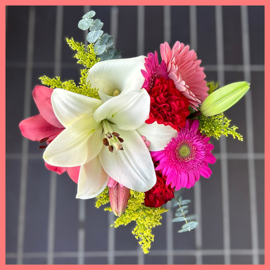 The Xmas Breeze bouquet includes mixed stems of lilies, gerbera daisies, mini callas, carnations, aster, and eucalyptus! Please note that as flowers are a live product, colors, and varieties may slightly vary from the photos shown to provide you with the freshest and most beautiful bouquet.