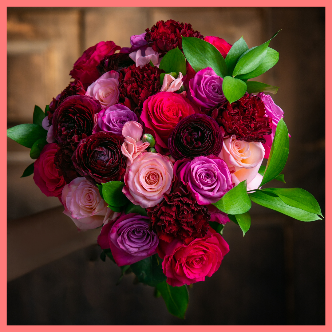 The Her Majesty bouquet includes mixed stems of roses, dianthus, carnations, ranunculus, and ruscus. Please note that as flowers are a live product, colors and varieties may slightly vary from the photos shown to provide you with the freshest and most beautiful bouquet.